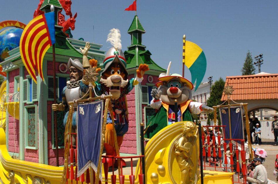 Colorful parade with costumed characters on Spanish streets