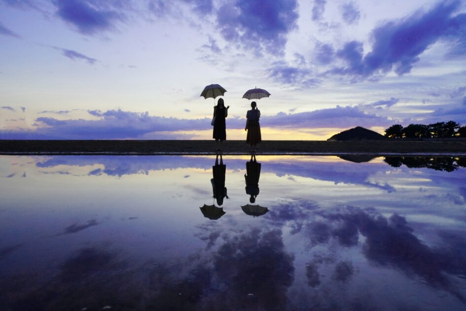Perfect mirror reflection on Chichibugahama Beach during golden hour