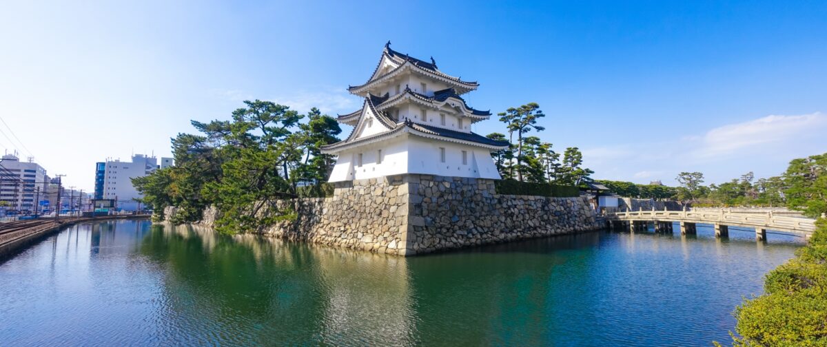 Takamatsu Castle ruins with traditional turret and seawater moat at Tamamo Park