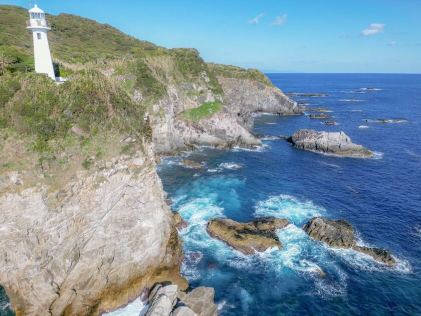 Cape Ashizuri white lighthouse on cliff edge overlooking Pacific Ocean Kochi Japan