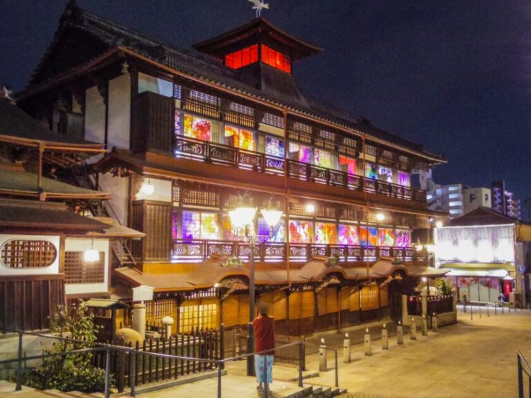Dogo Onsen Honkan main building illuminated at night in Matsuyama, Ehime Prefecture